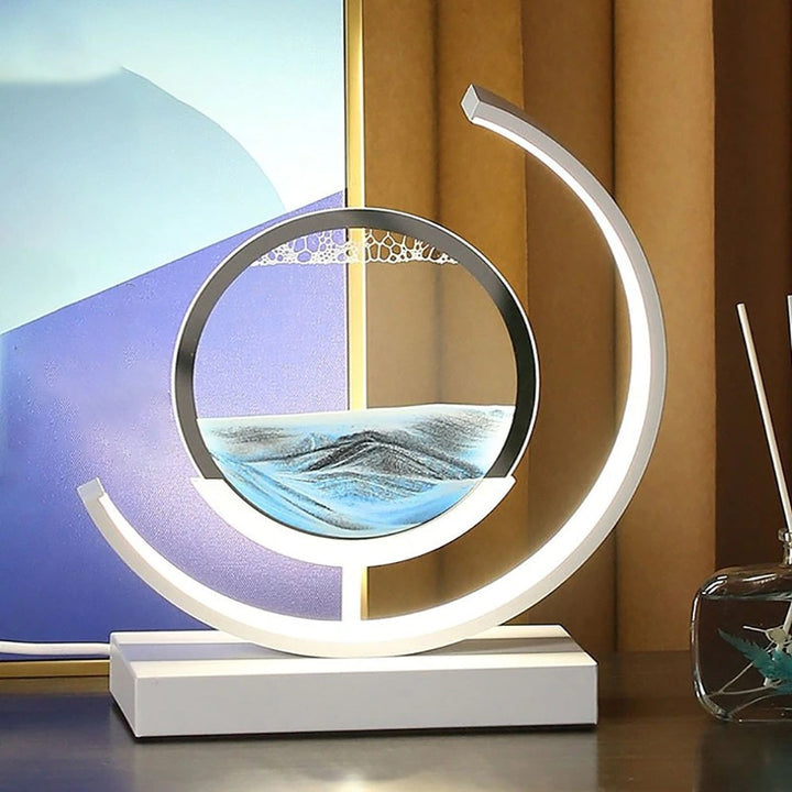 Dynamiczna lampa stołowa z obracającą się akrylową obudową i ruchomą sztuką piaskową 3D