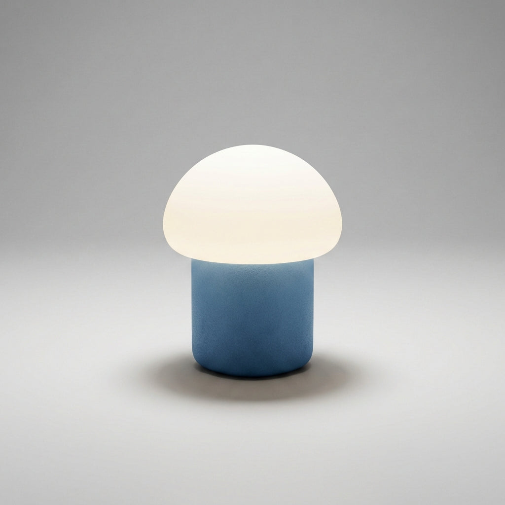 Minimalistyczna kompaktowa lampa stołowa z sylwetką grzyba i obciążoną podstawą