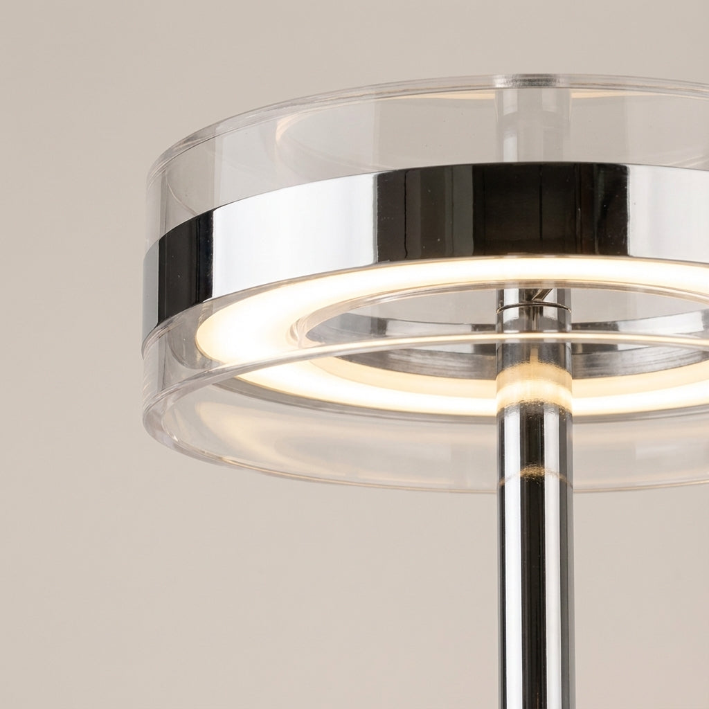 Elegancka cylindryczna lampa stołowa z przezroczystym kloszem i smukłym prętem