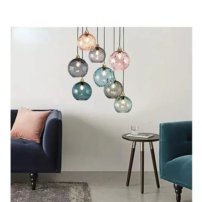 Minimalistyczna żelazna lampa wisząca ze szklaną kulą