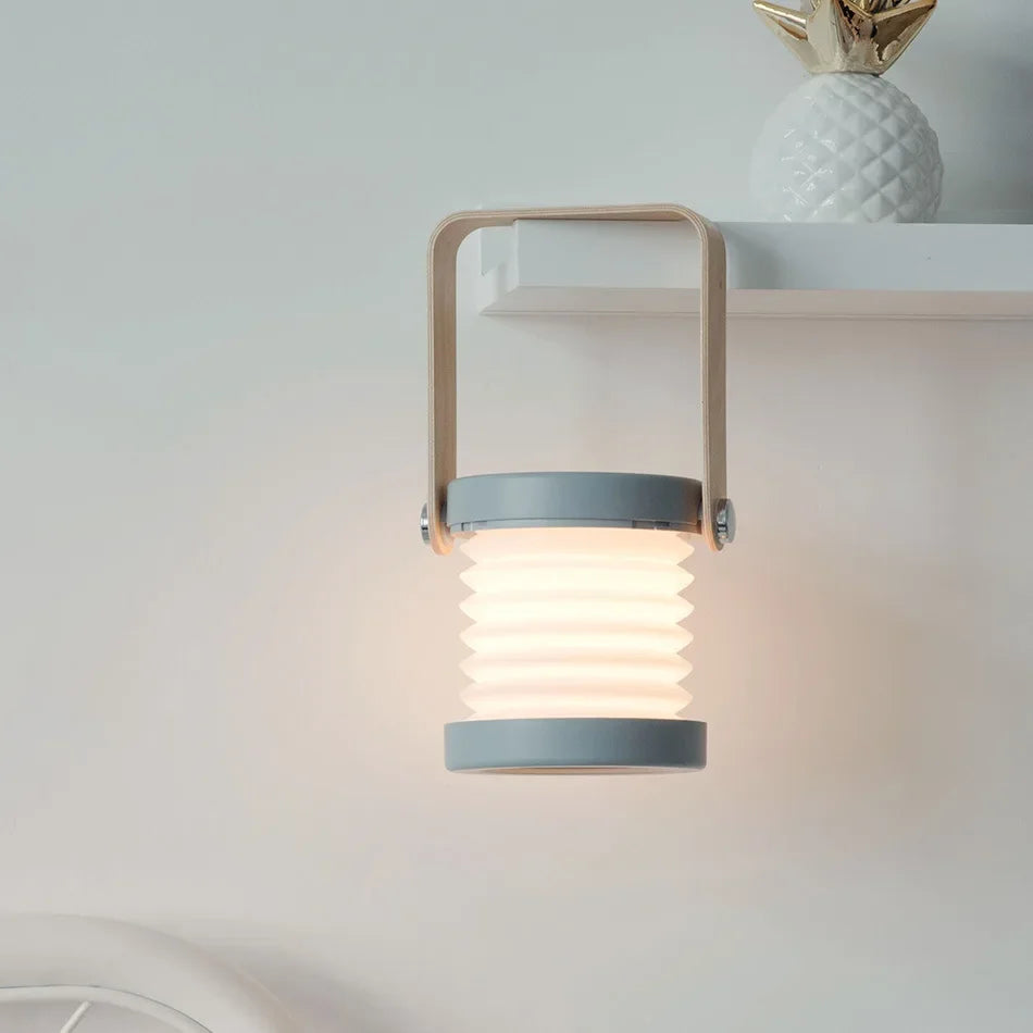 Składana skandynawska minimalistyczna przenośna lampa stołowa z drewnianym uchwytem, ładowana