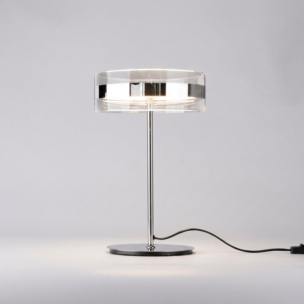Elegancka cylindryczna lampa stołowa z przezroczystym kloszem i smukłym prętem