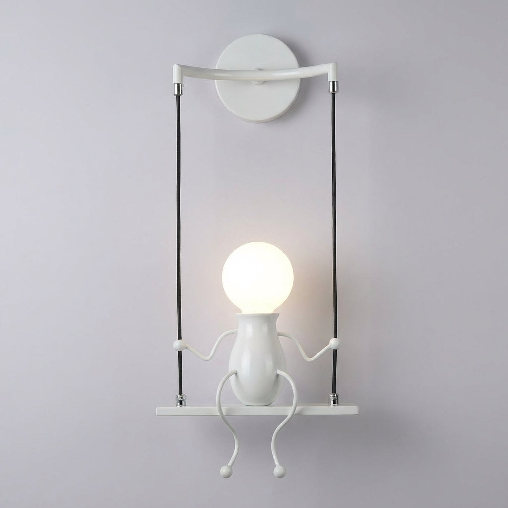 Trwała metalowa lampa ścienna z sylwetką kołyszącej się postaci